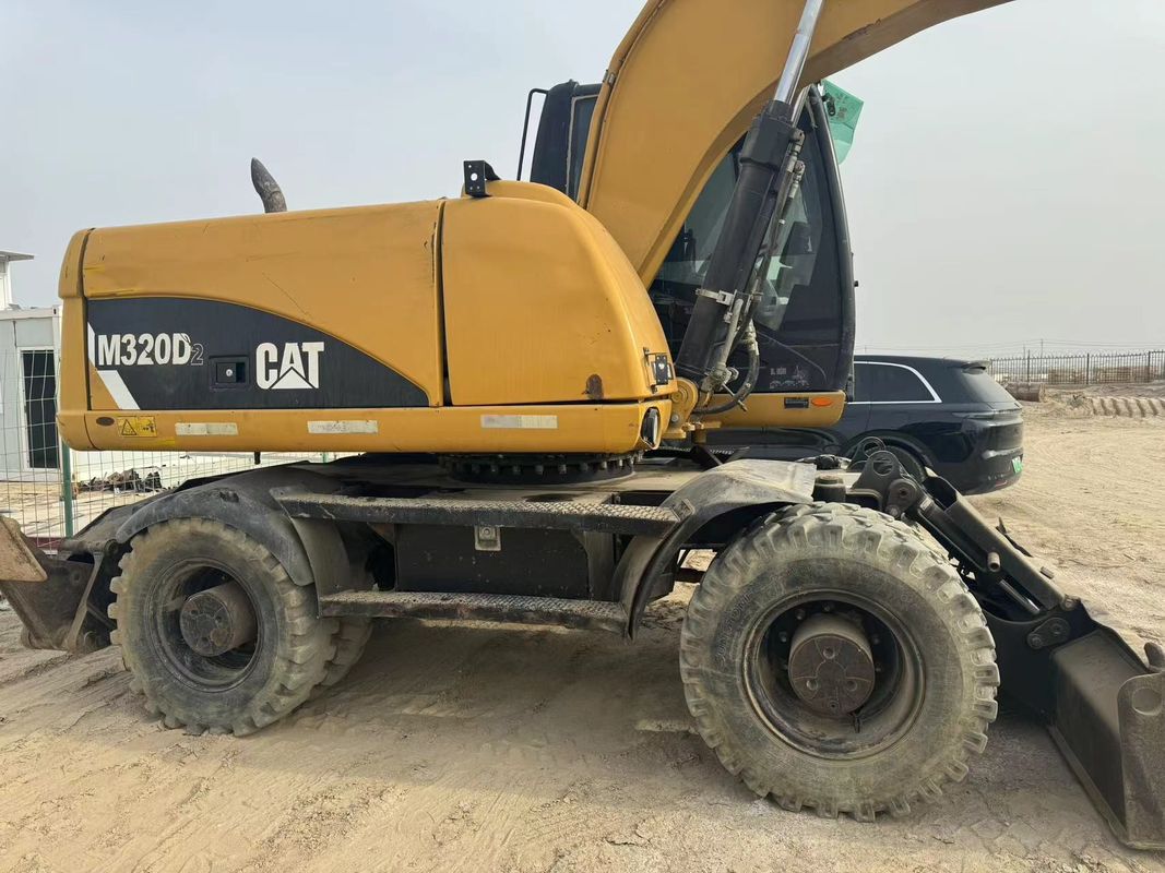 90% Caterpillar M317D2 Excavateur à roues d'occasion de haute qualité et de meilleures performances à vendre